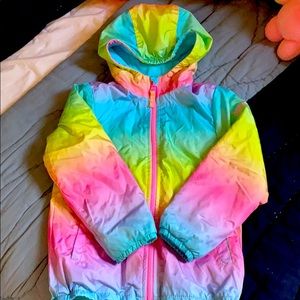Puffer rainbow jacket with fleece lining.